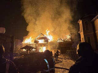 Ukrainian rescuers working at the site where a Russian shock drone hit a private building in Kryukivshchyna village of Kyiv